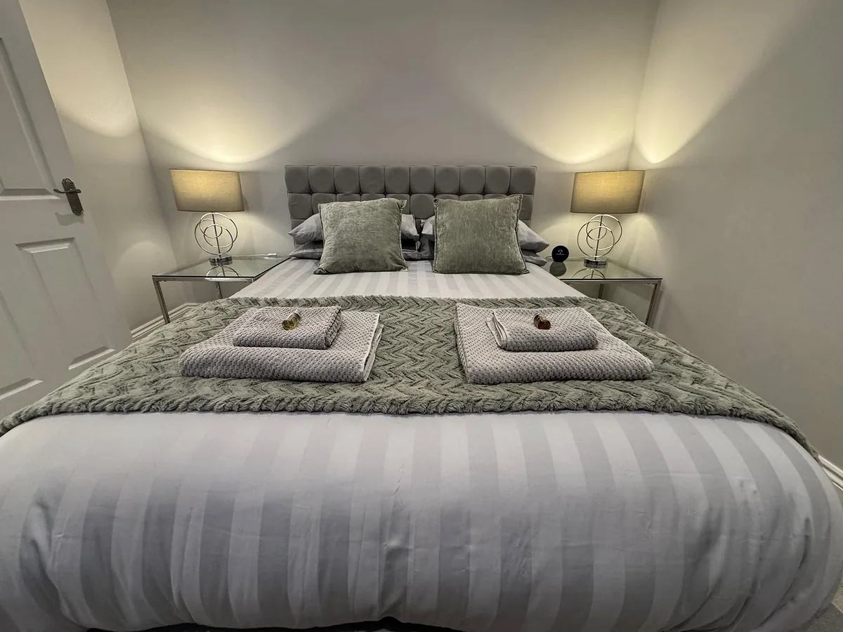 Hotel-standard bed made during an Airbnb changeover in Preston